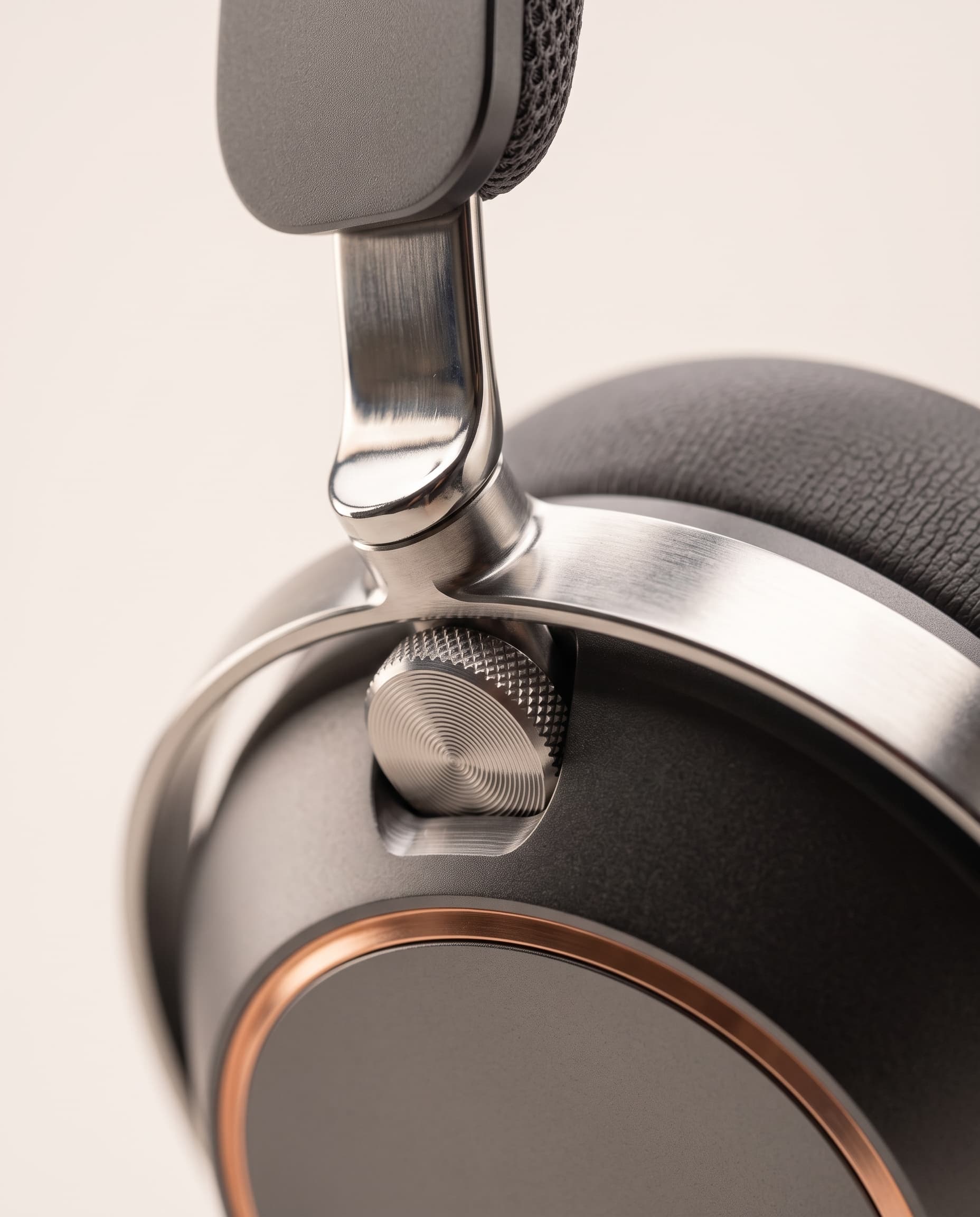 Close-up of the polished stainless steel slider, hinge and knurled crown